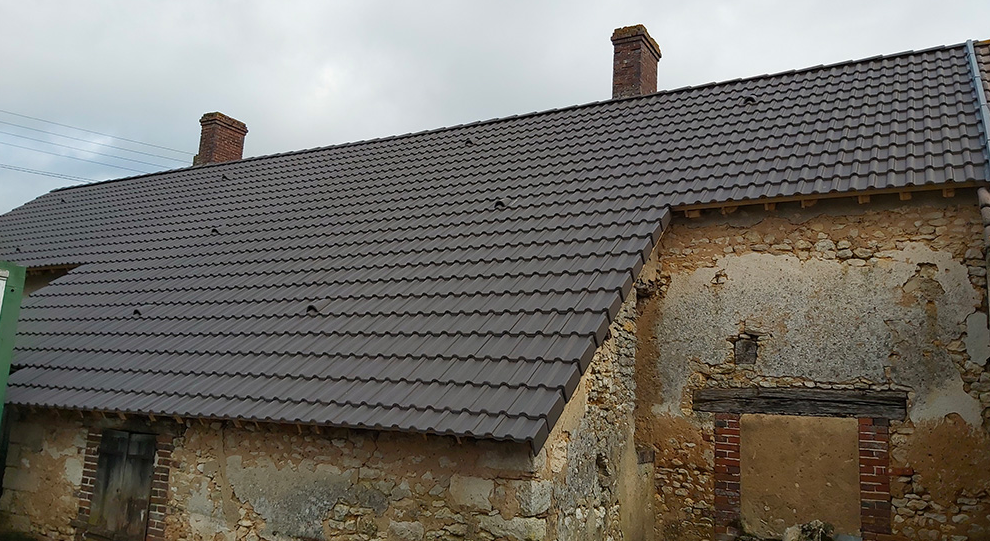 Toiture après rénovation par Artisan Debosscher - Résultat professionnel réparation toiture Lot